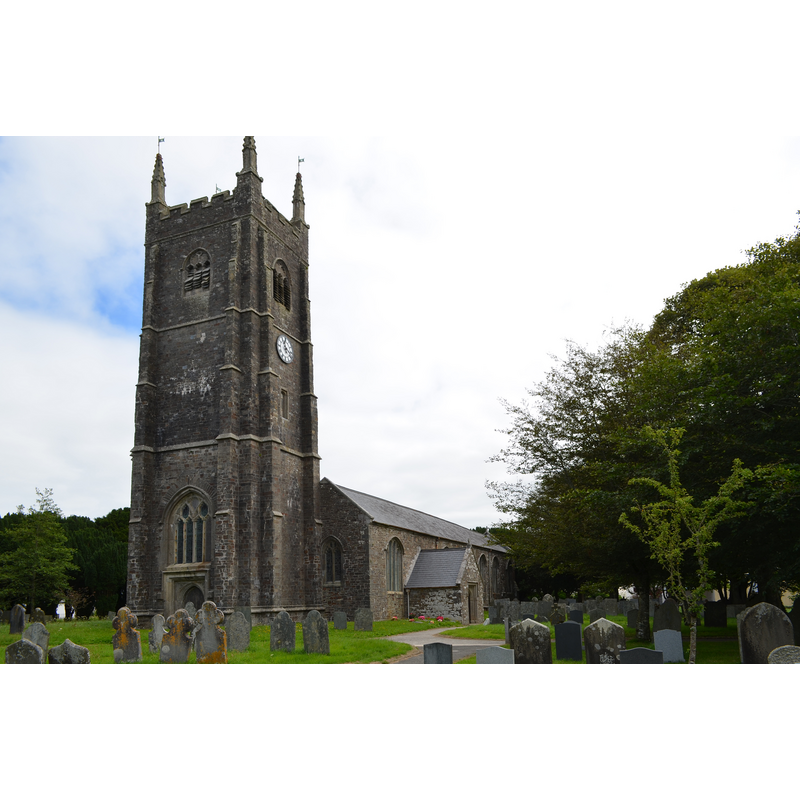 Source caption: "St James the Great church, Kilkhampton. The church dates from the 12th century onwards, although most of it is perpendicular. [...] The south door is Norman with a zigzag pattern and there are a variety of capitals including heads and pinecones."