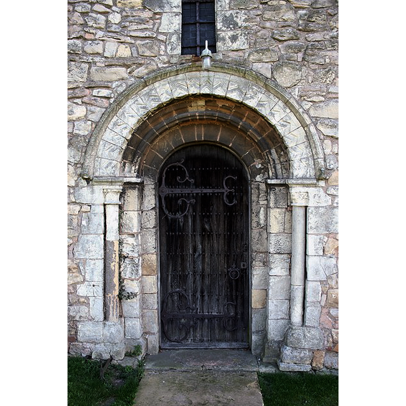 Source caption: "Norman, 12th century west tower door at St. Lawrence's church"