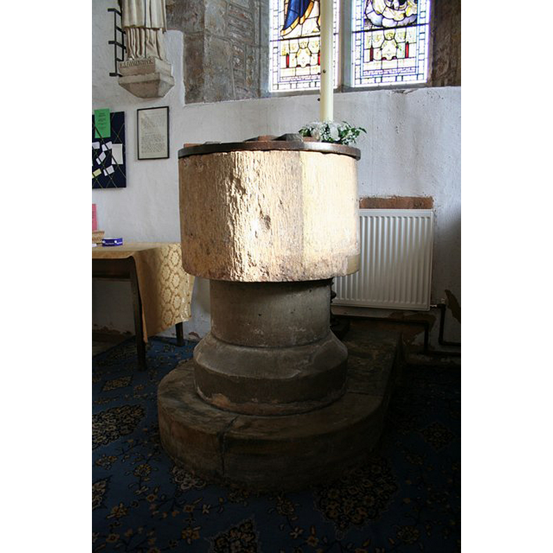 Source caption: "St.Lawrence's font. Early Norman 11th century font, moved to the south transept in 1969."