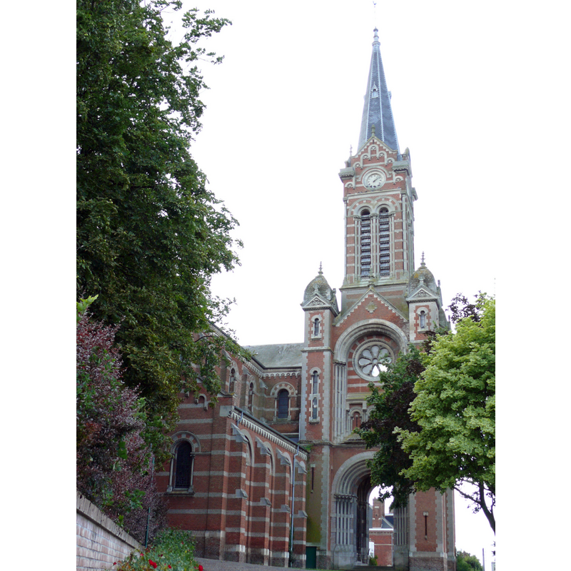 the late-19thC replacement church; due to constraints of the terrain the main façade of the church is oriented to the north; the large portal and bell tower face west, towards the main street