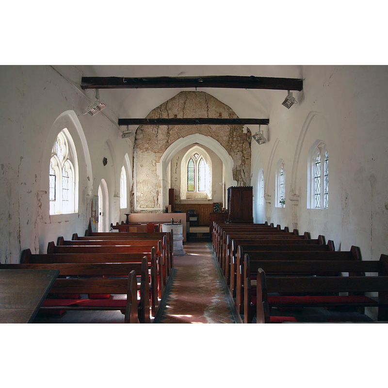 the font and cover are visible towards the west end of the nave, opposite the south entranceway