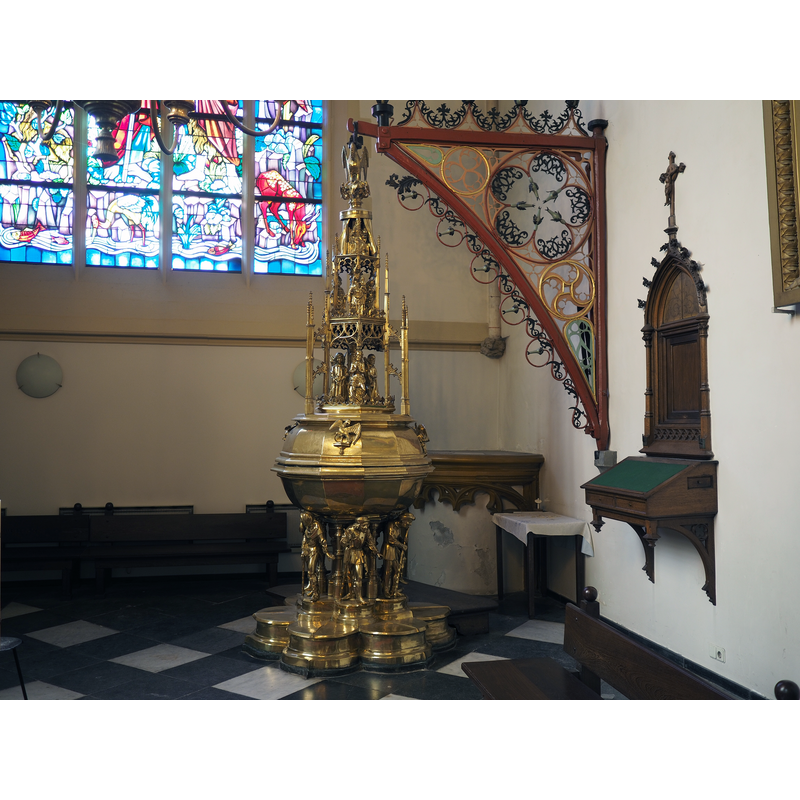 the font and cover with the elaborate wall-mounted crane