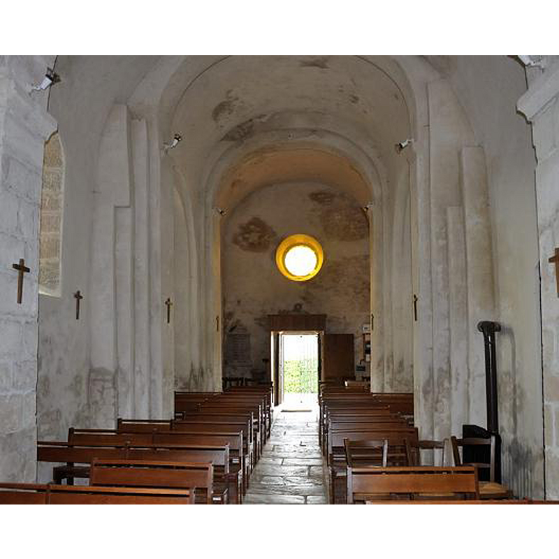 the top of the font is discernible at the far end, to the right [north] of the west entranceway