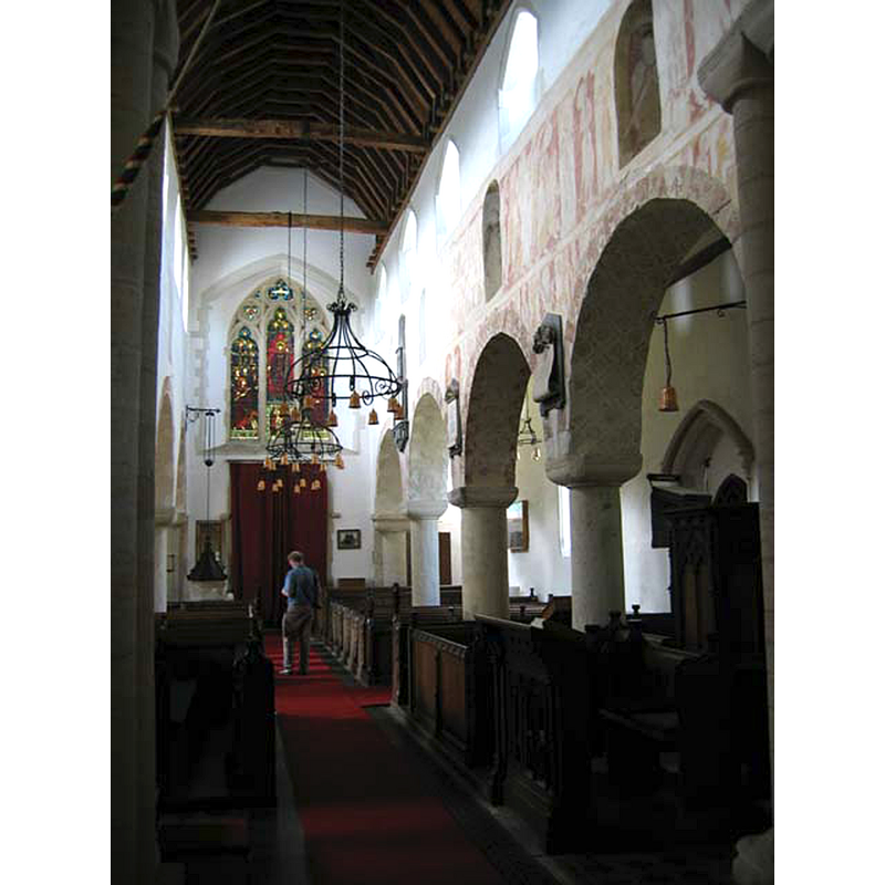 the modern font and cover are partially visible at the far end, left [south] side of the nave