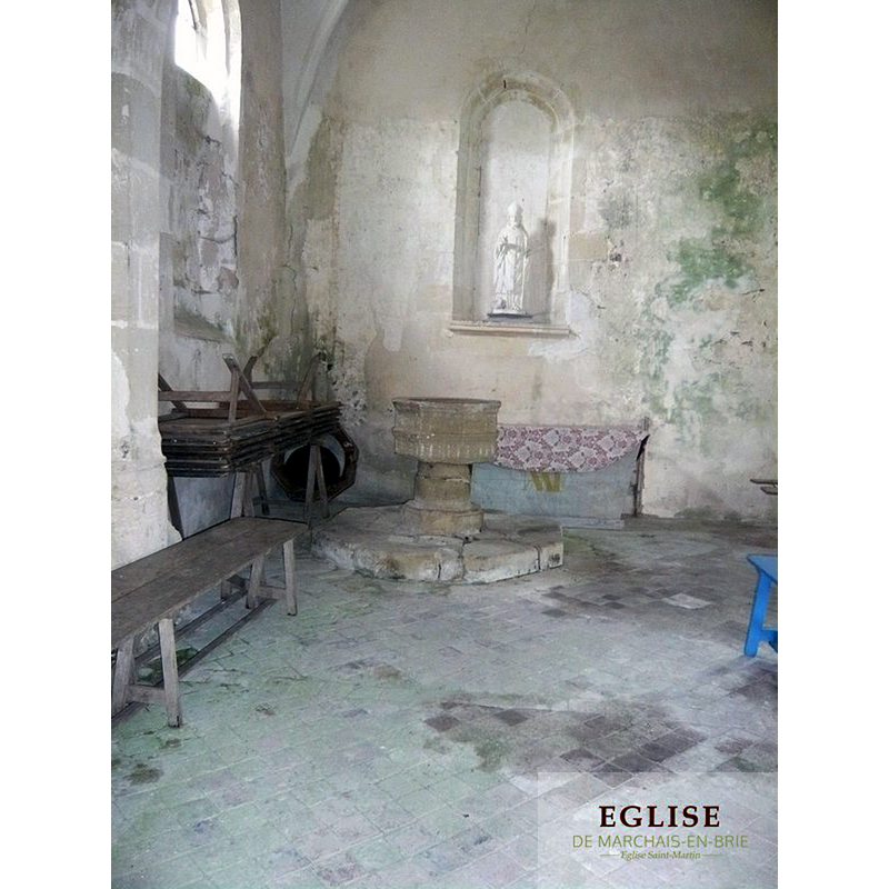 the font at the west end of the north aisle -- the font cover stands in the corner, to the left of the font