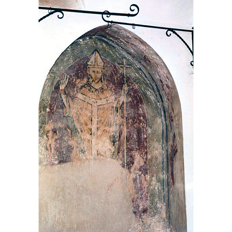 Source caption: "St Thomas Becket. An early wall painting of the martyred Archbishop of Canterbury in St Edmund's Church. The saint is shown with his right hand uplifted in blessing, and was probably painted around 1250."