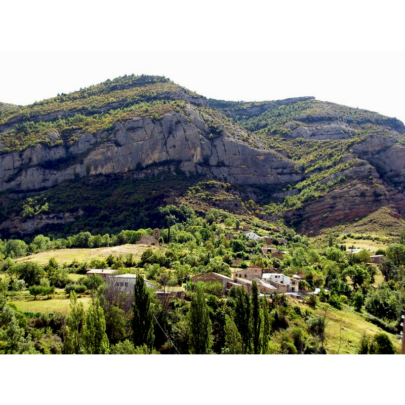 the church is visible towards the centre of the image, by itself on the left, at the foot of the mountain