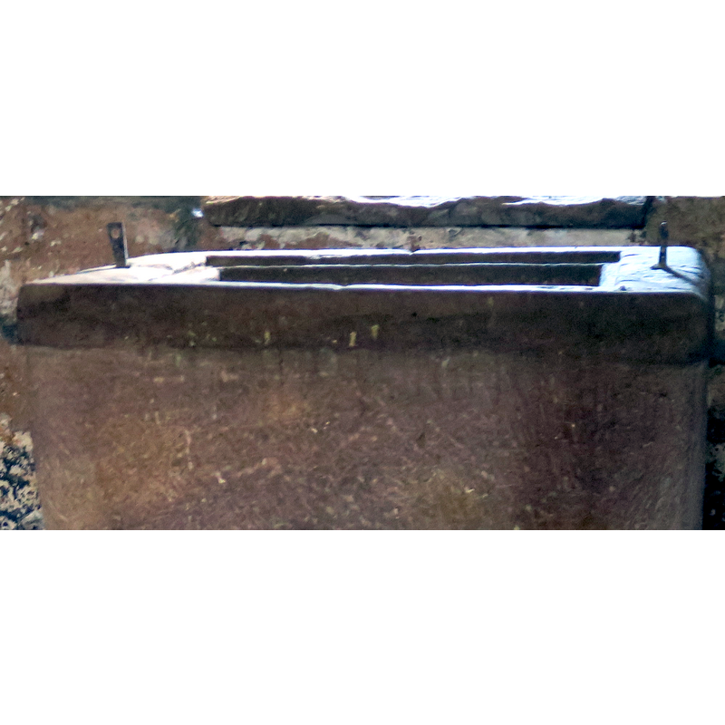 the upper rim of the basin, with its two metal staples from an old font cover; the shape of the inner well rim was carved to fit a square cover
