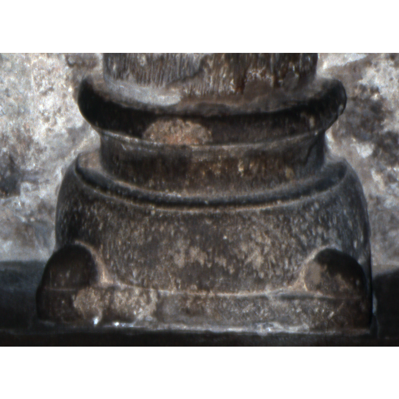 one at each angle of the square lower base