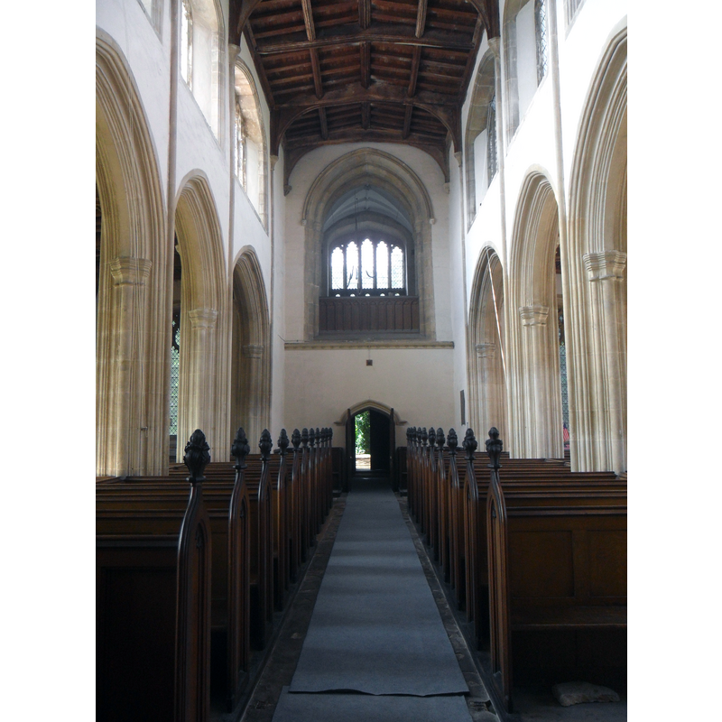 Source caption: "Interior of All Saints, Conington. Looking down towards the West end of the church with the impressive cut out that reveals the ringing gallery. Although redundant and not used for regular worship, 2 services are still held in the church each year."