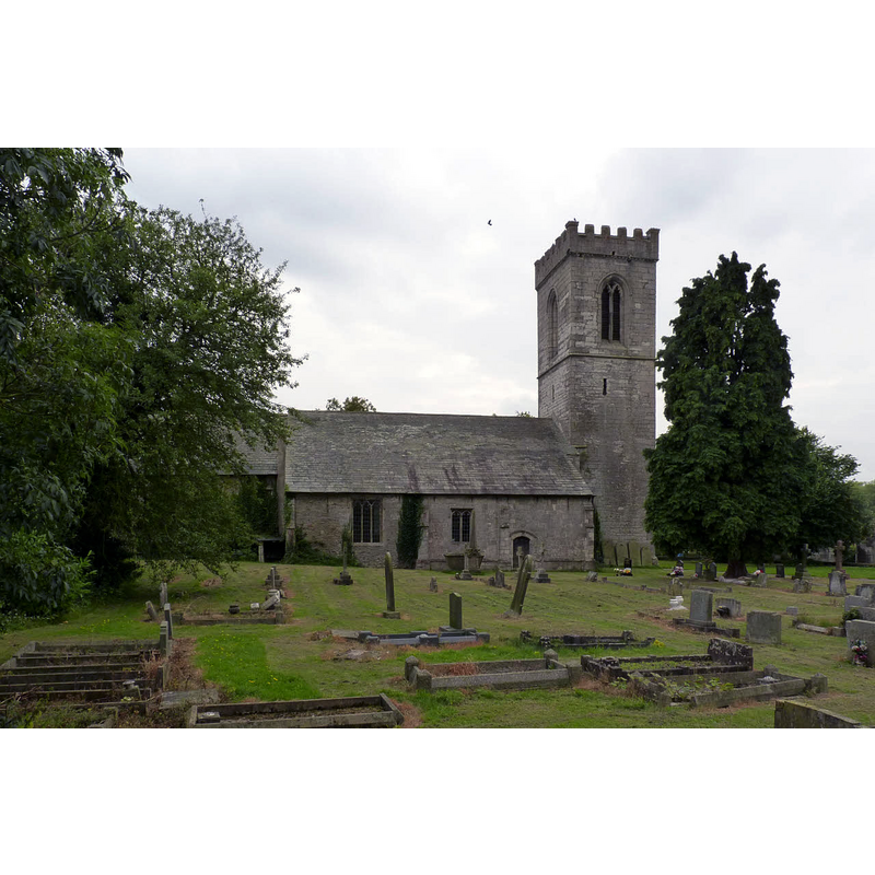 Source caption: "Church of All Saints, Rampton. View from the north. The north aisle and tower are 13th century, although the aisle windows are late 16th century insertions."