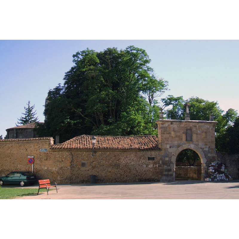the east end of the church is partially visible behind the exterior monastery wall