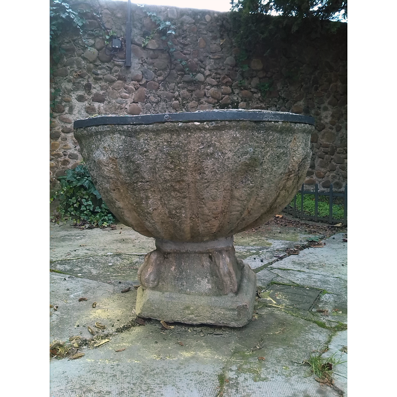 a disused stone font now in the coutyard of the monastery