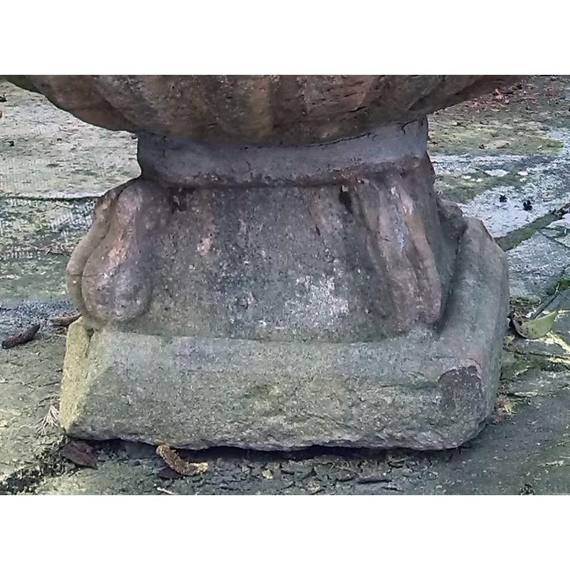 double scrolls at the angles of the round-to-square lower base; at least one of the four is damaged