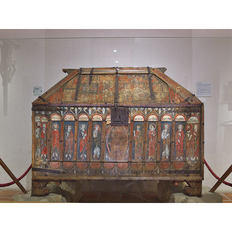 chest from the original monastery church, now in a museum -- Source caption: "Elemento del mobiliario del monasterio cisterciense (ca. 1176), realizado en madera policromada con pinturas al temple, datado en torno al 1300 y con función de deósito de reliquias, o de ornamentos litúrgicos. Su programa iconogáfico y ornamental, constituye una muestra representativa del arte románico leonés en la segunda mitad del siglo XIII."