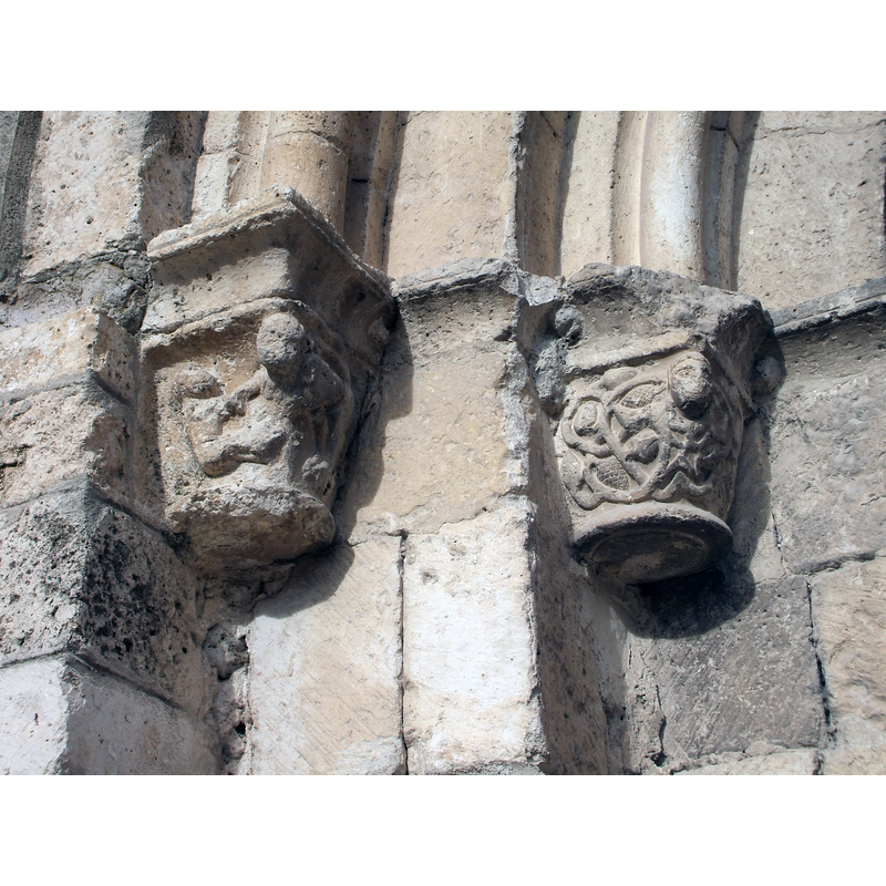 capitals on the left side of the portal