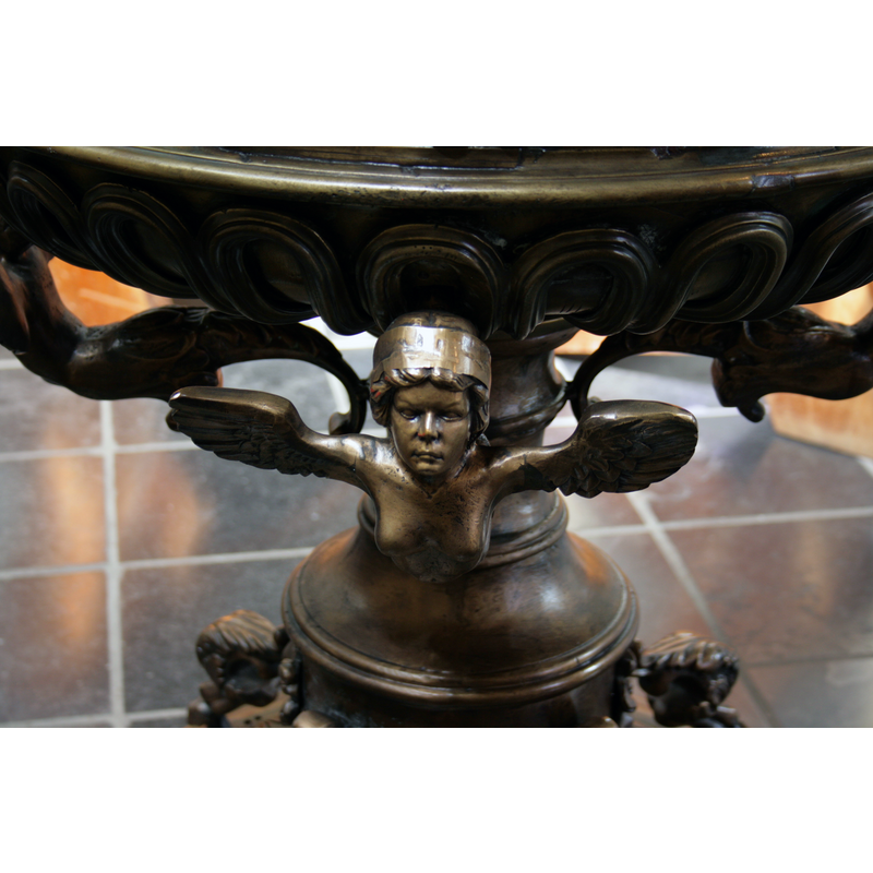one of four siren-like angels (?) on the upper base