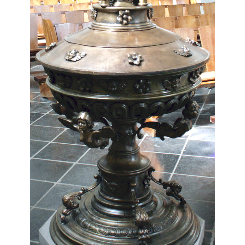 several of them, alternating with rosettes, on the lower neck of the font cover