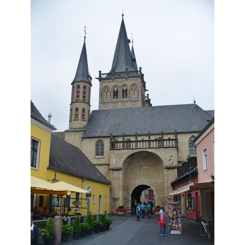 the church towers are visible behind the city gate