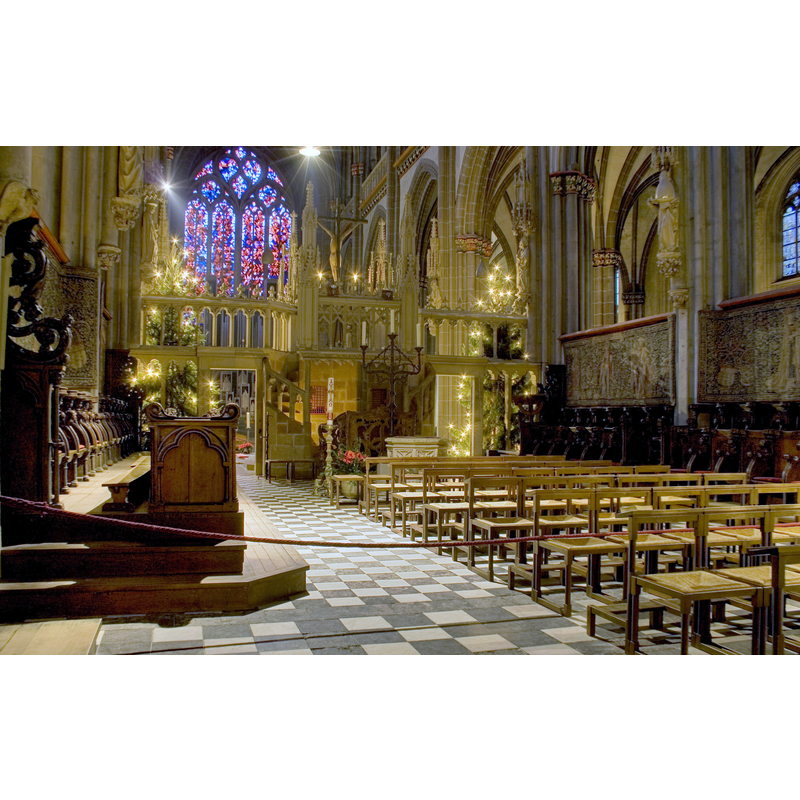 the Renaissance (?) font is partially visible in the centre of the image, at the foot of the tall candelabra
