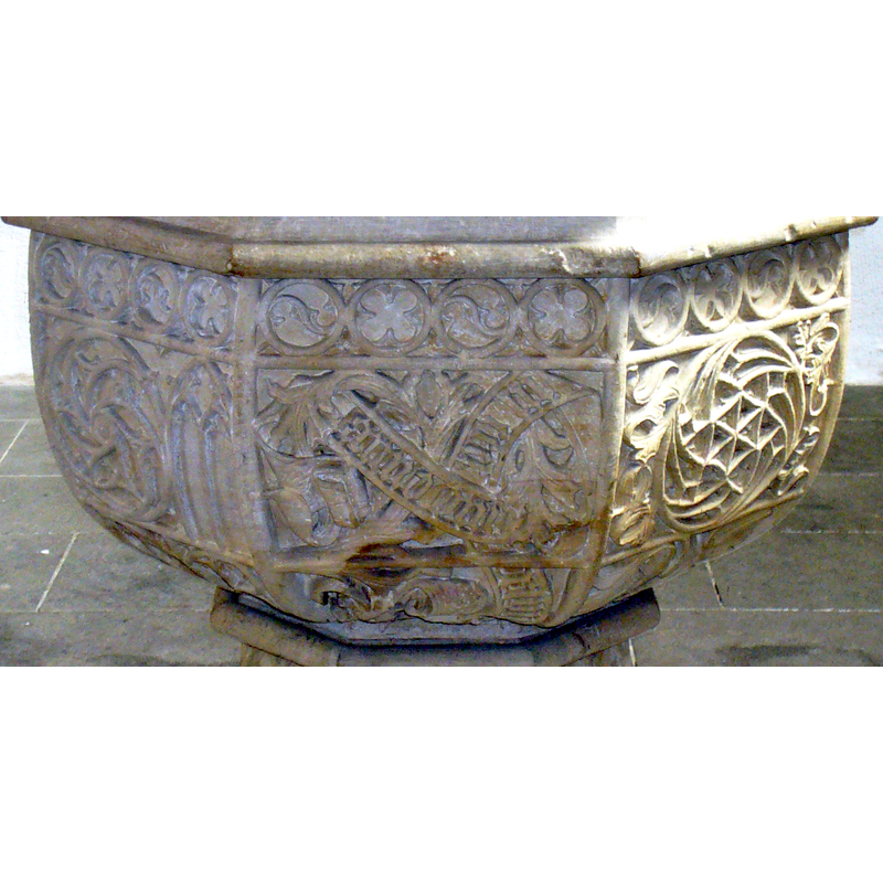 on the front (?) panel, surrounded by tracery patterns