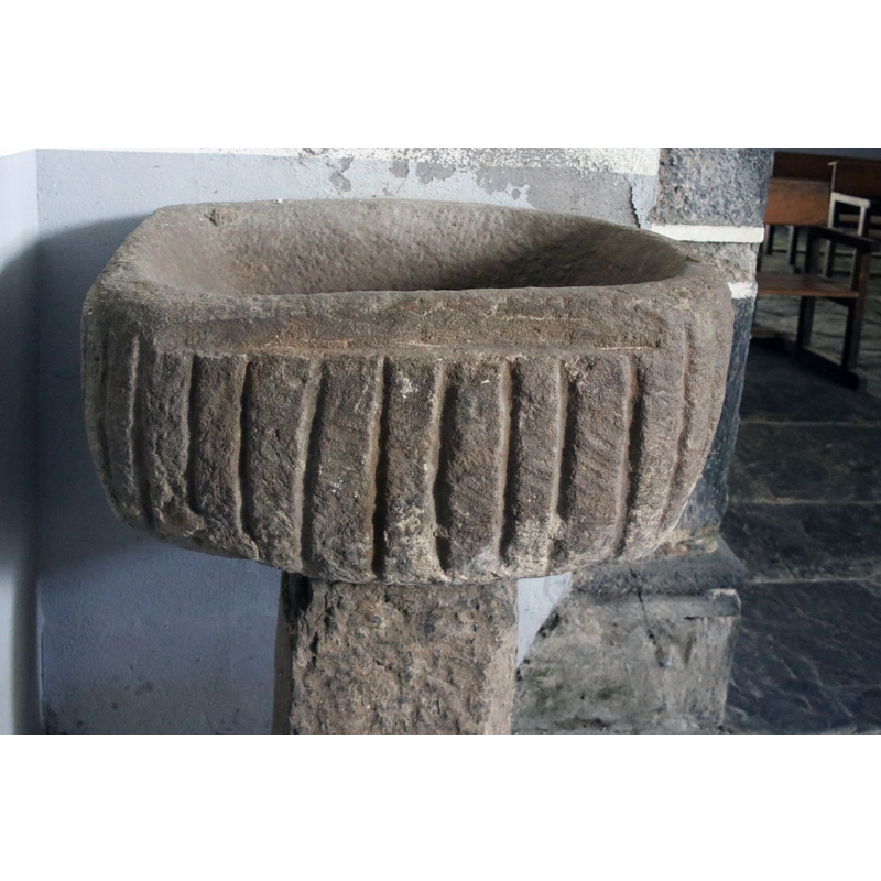 on the front side of the basin
