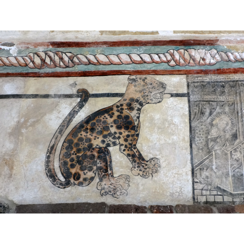 Source caption: "Fresco de jaguar en el interior del convento." -- Interesting sample of the 'tequitqui' art: the Mayan jaguar with the knotted Franciscan cingulum above