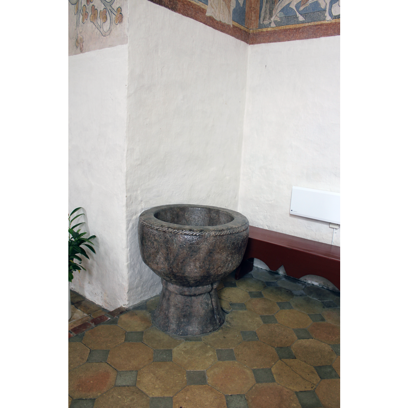 the font by the north side of the chancel arch