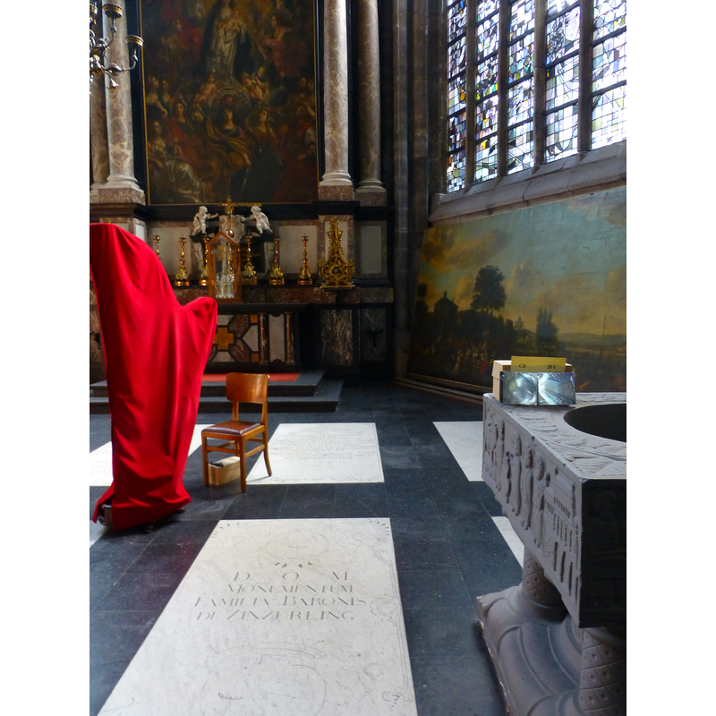 partial view of the modern replica of the Termonde / Dendermonde baptismal font in one of the ambulatory chapels
