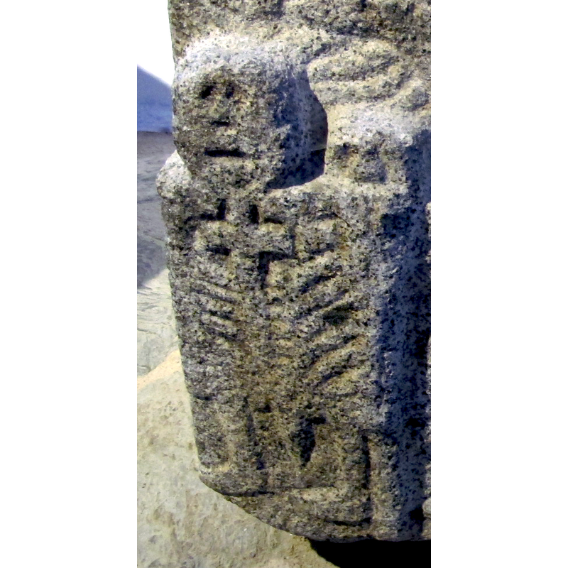 one of three; the figure on the left side of the front panel
