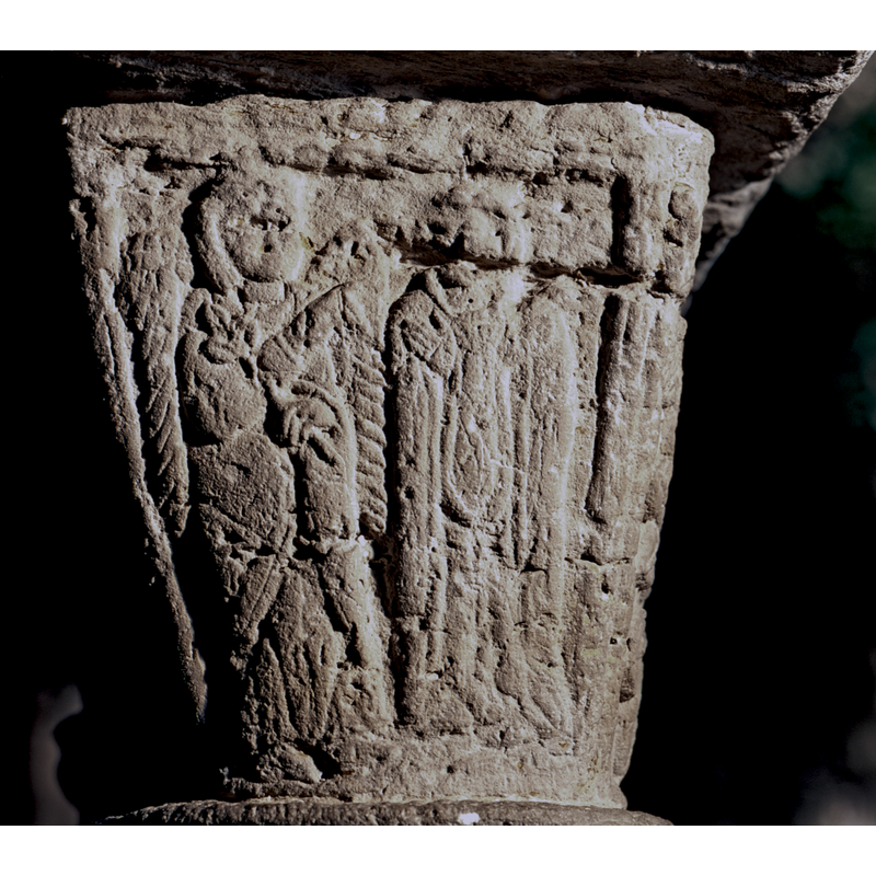 this capital appears different in style and composition from the majority of the others in this cloister; this side appears to be the Annunciation to Mary by Gabriel