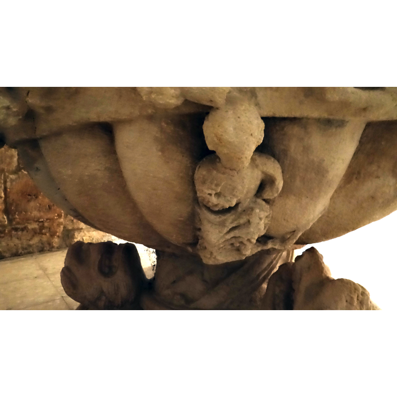 Over one of the ribs in the under-bowl there is a scene of Christ stepping on a monstrous dragon to which is attached a serpent
