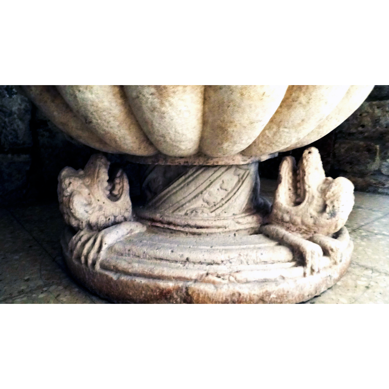 two of three beasts present on the lower base, at 120-degree angles; looking up to the basin