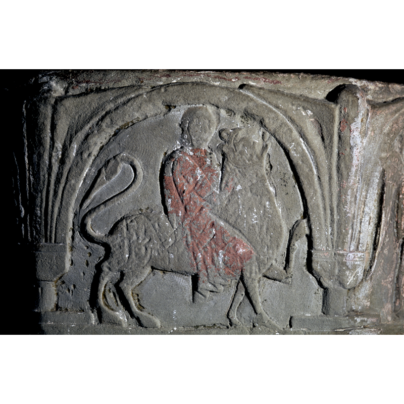 on the northeast side of the basin -- Faces toward the right. It shows a man on a lion. Samson riding or fighting a lion like figure. Holding it by the neck.