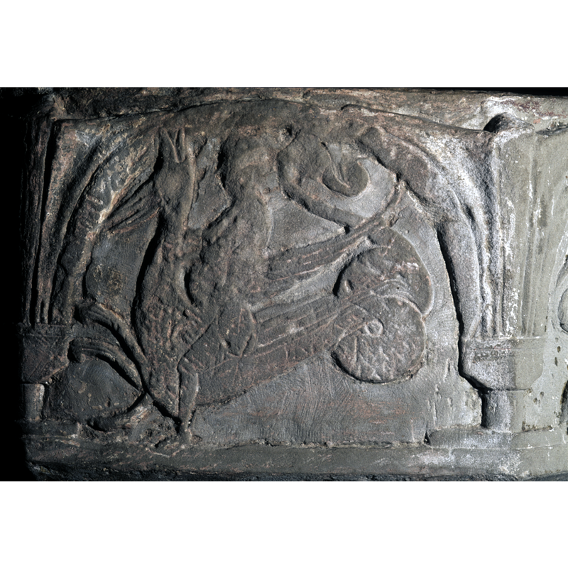 on the east side of the basin -- Man riding a Grip. Winged, bird like serpent. Serpent faces to the left - as was the previous scene on this font.