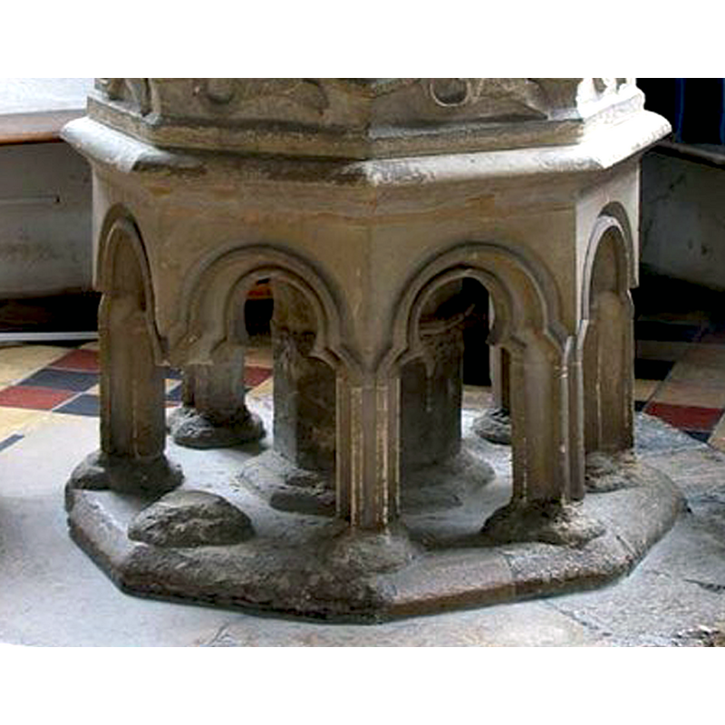 open arches, leaving the inside hollow except for the central shaft; some are damaged and their bases eroded; one is missing a column and the central stem now includes a partial replacement