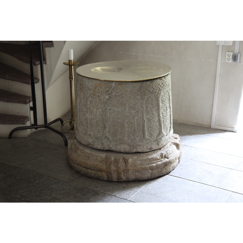 with the modern baptismal dish on it