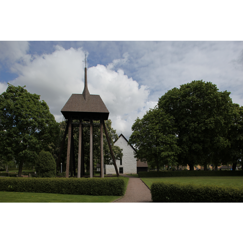 showing the detached wooden bell tower in the foreground