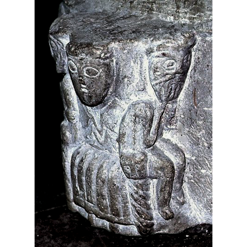 unlike the other two figures of this group this one is either naked or wears tight fitting clothes and has an unhappy demeanour, hunched and with the bearded head resting on his hands