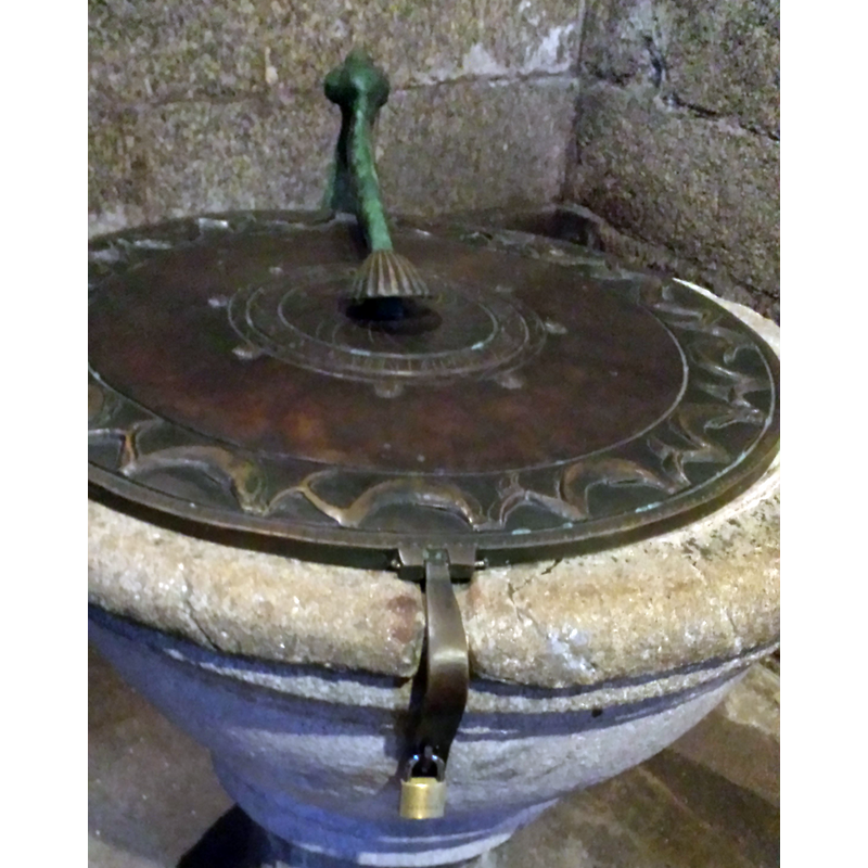 the arm with the scallop end is visible here, with the locking hasp at the front