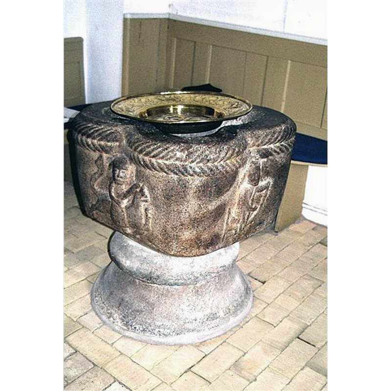 with the brass baptismal dish on it