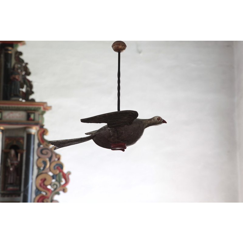 the dove hanging above the font