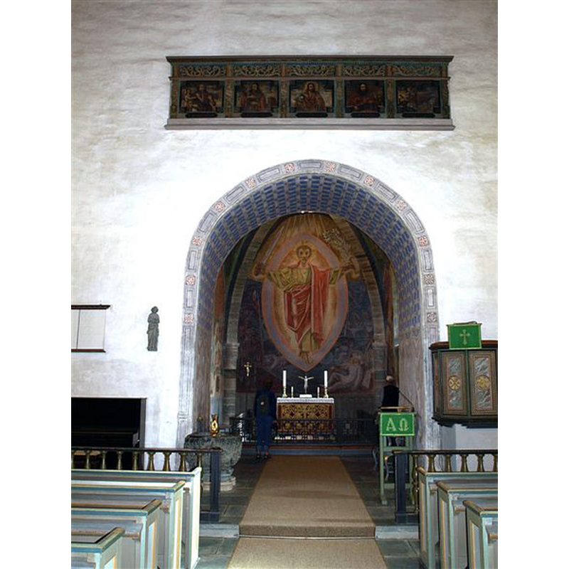 the font is against the north side of the chancel arch, west of it