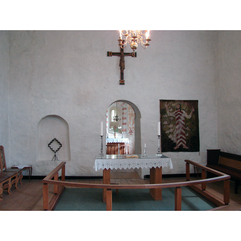 the present altar is set at the east end of the nave, with a communion railing, but the old chancel can be seen through the centre arch behind