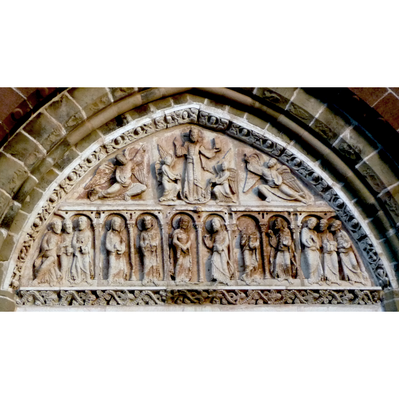 white limestone tympanum of the 12th century; it was hidden from view in the façade during the late-16thC wars of religion, and re-installed in 1923