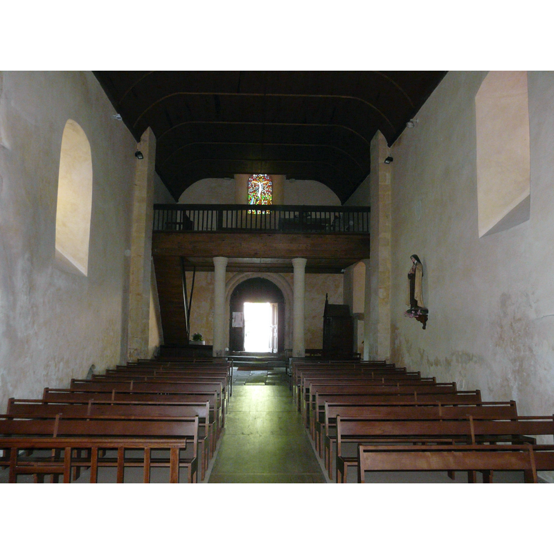 the large stone font is partially visible at the far [west] end, left [south] side, by the stairs leading up to the gallery