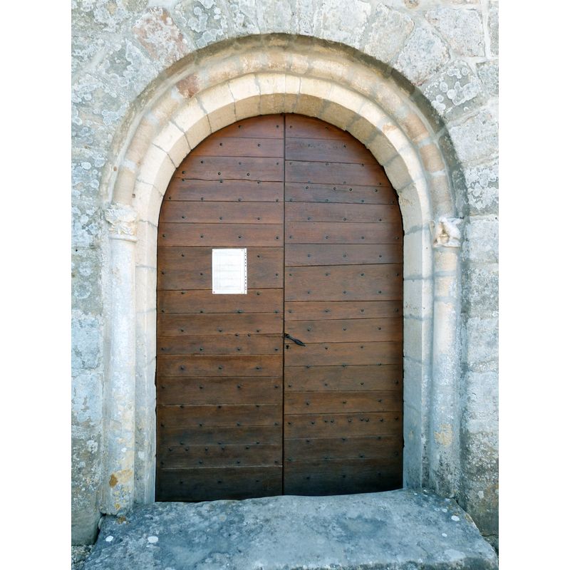 Source caption: "Portail avec moulure demi-cylindrique de l'église Saint-Gilles"