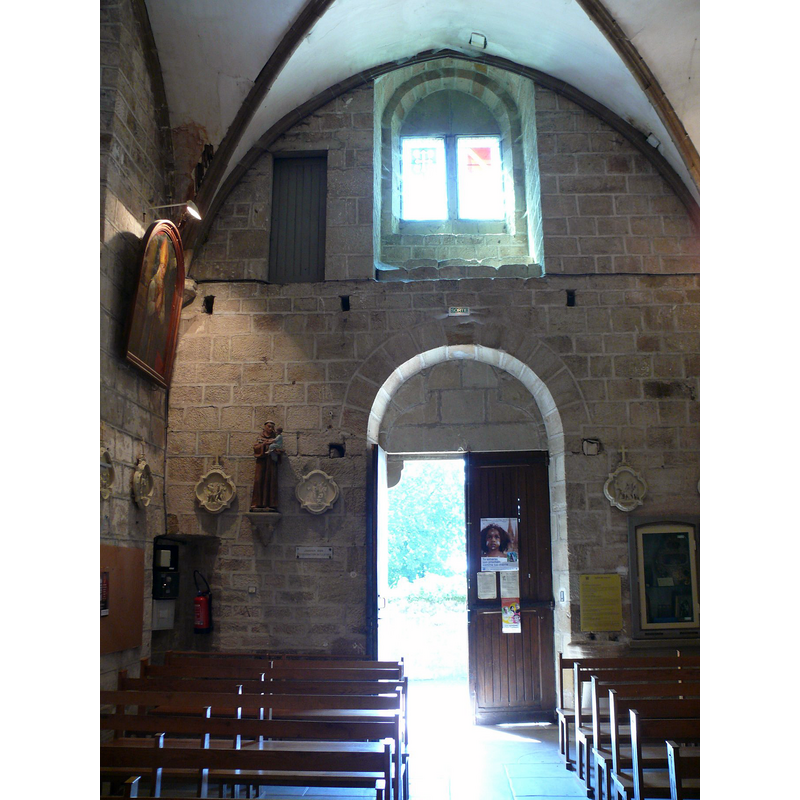 showing a stone holy-water stoup on the north side of the entranceway