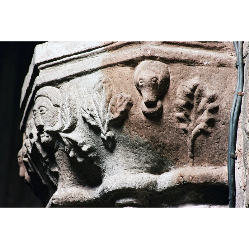 a late-15thC capital decorated with a Green Man and other fanciful motifs