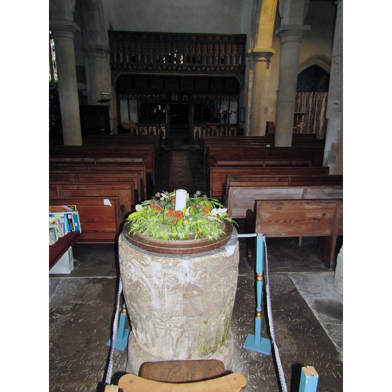 at the west end of the nave, centre aisle